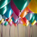 selective focus photography of assorted-color balloons