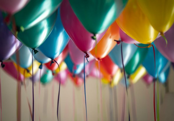 selective focus photography of assorted-color balloons